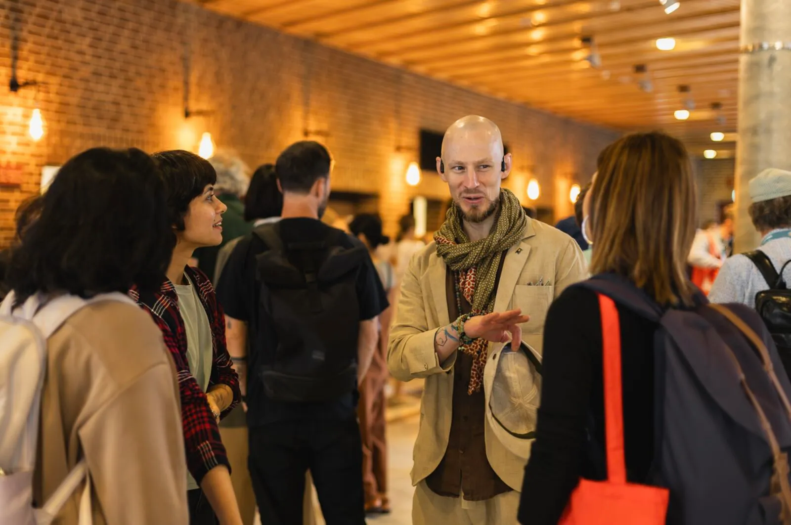 Attendees chatting in a busy conference hall