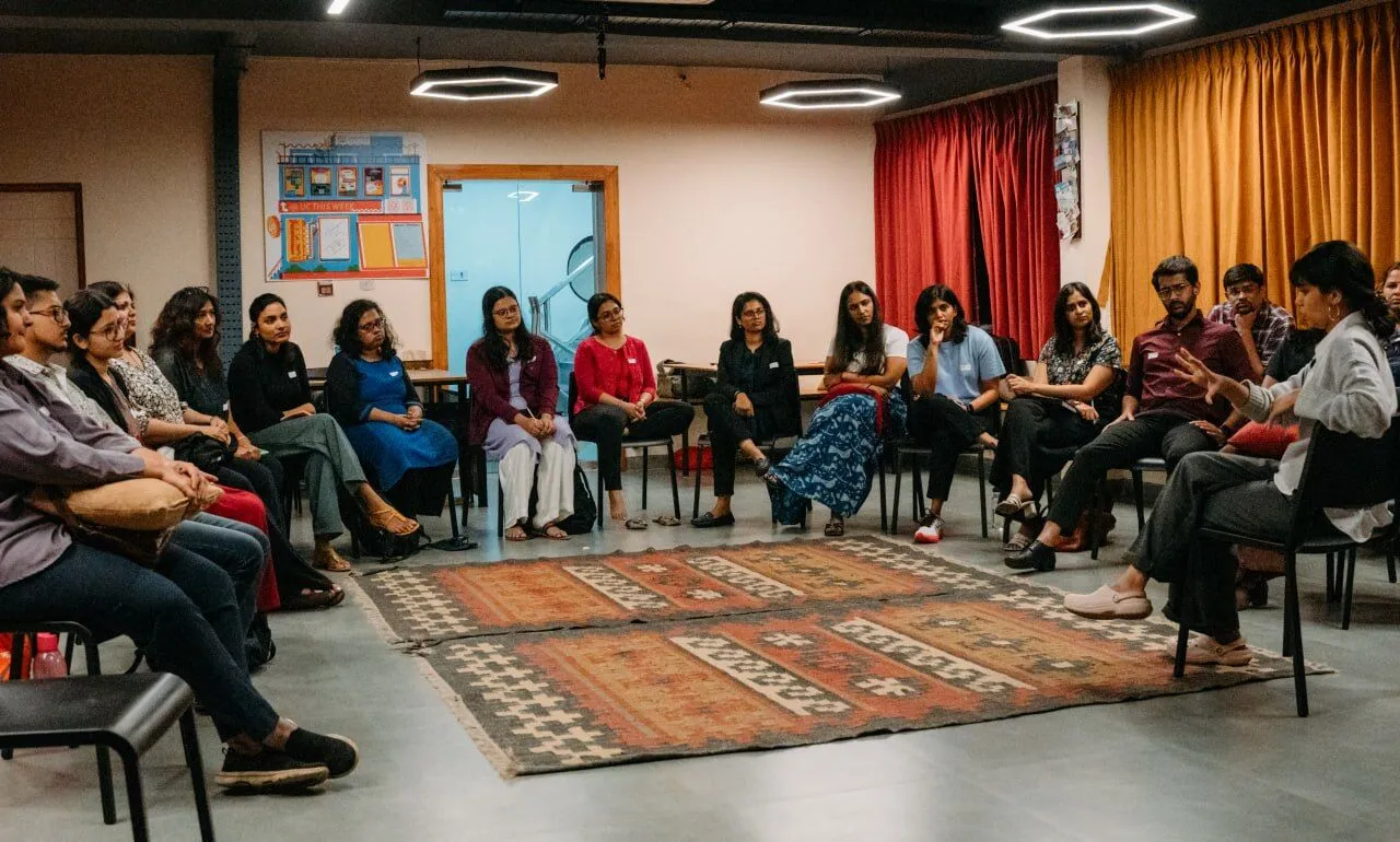 Members of the EFT India Network seated in a circle at a network meeting